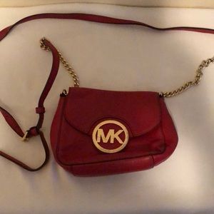 Michael Kors /red /metal and leather straps.